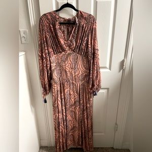 Beautiful brand new long-sleeved maxi dress. Never worn!